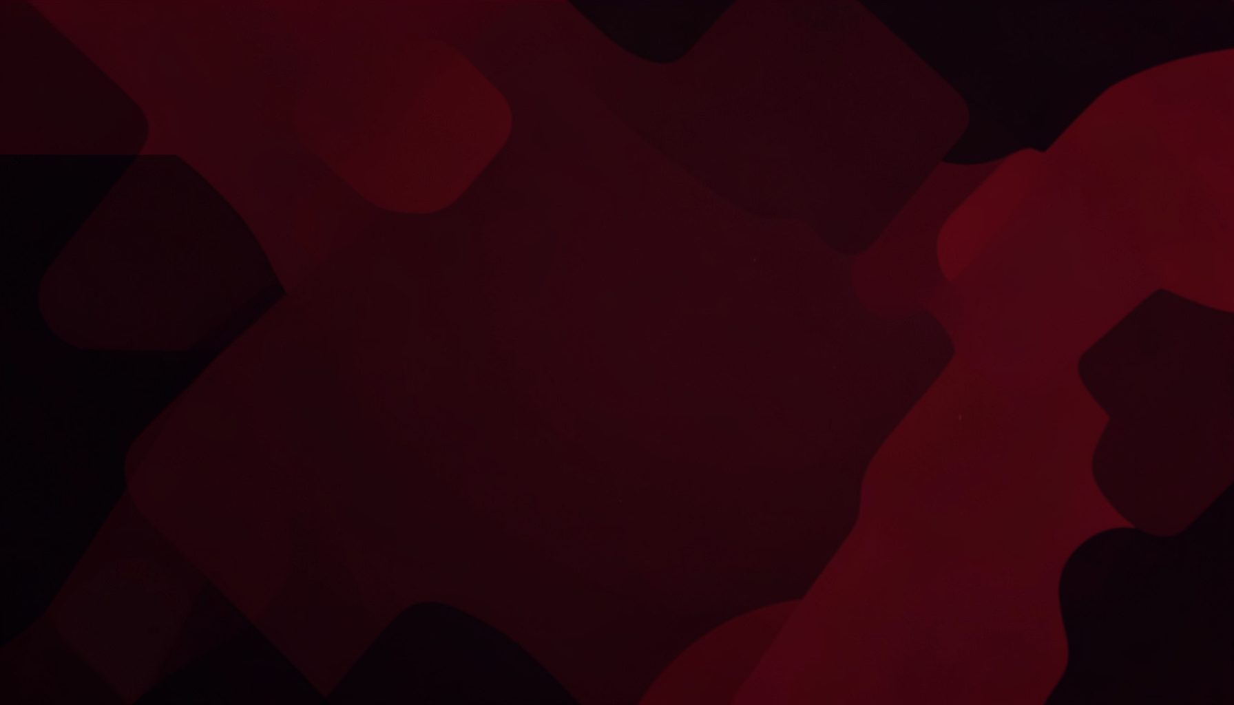 A dark red and black abstract background with soft geometric shapes evoking a technology and gadget review theme